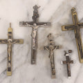Lot 111 - Grouping Of Seven Vintage Crosses In Wood, Metal, And Plastic Including Two Golgotha Pectoral Crucifixes With Skull And Crossbones Motif