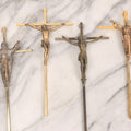 Lot 112 - Grouping Of Four Modern And Vintage Metal Crucifixes With Mixed Finishes