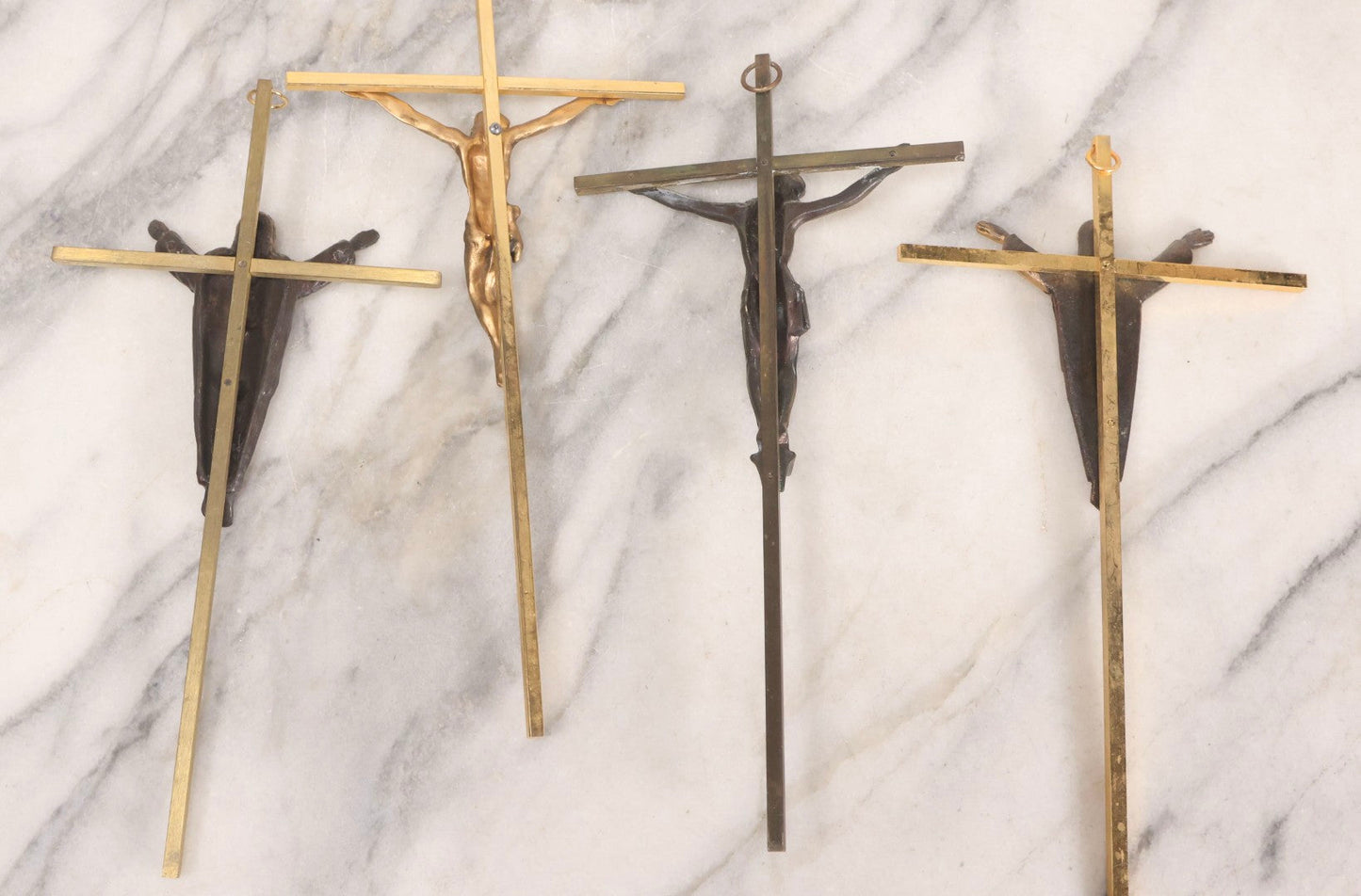 Lot 112 - Grouping Of Four Modern And Vintage Metal Crucifixes With Mixed Finishes