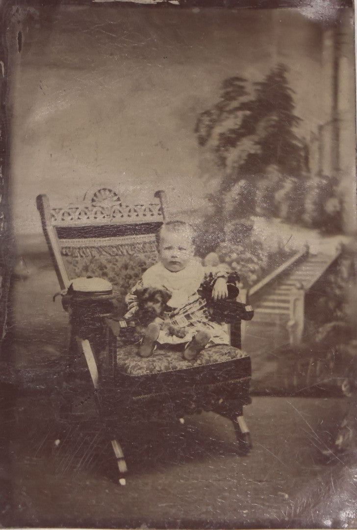 Lot 134 - Antique Uncased Tintype Photograph Of Seated Child Holding Small Dog