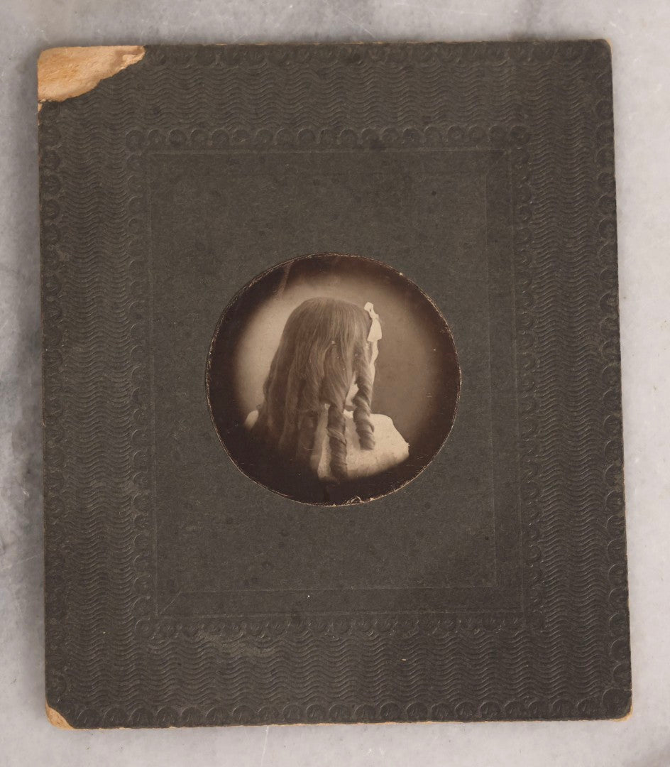 Lot 147 - Antique Small Size Boarded Photograph Of Young Girl With Curly Hair Viewed From The Back