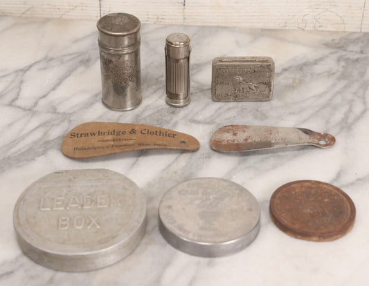 Lot 272 - Grouping Of Nine Vintage Advertising Objects Including Match Safe, Lion Brand Toothpaste Tin, Pet Milk Can Opener, U.S. Tobacco Co. Lid, And Shoe Horns From Strawbridge & Clothier And Sears Roebuck And Co.