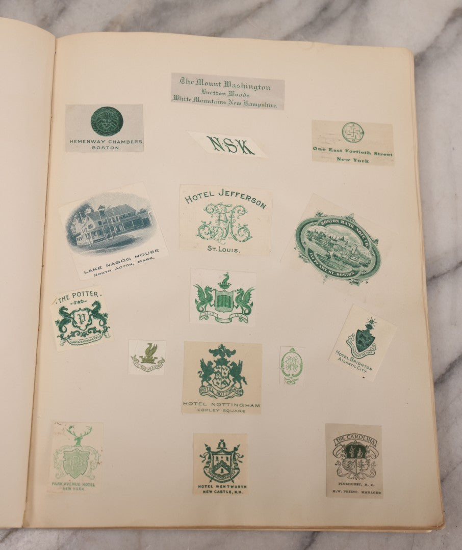 Lot 294 - Antique Scrapbook With Clipped Logos, Seals, And Institutional Names From Colleges, Hotels, Clubs, Banks, Government Offices, And More, Arranged By Color Throughout 20+ Pages, Marbled Cover Boards