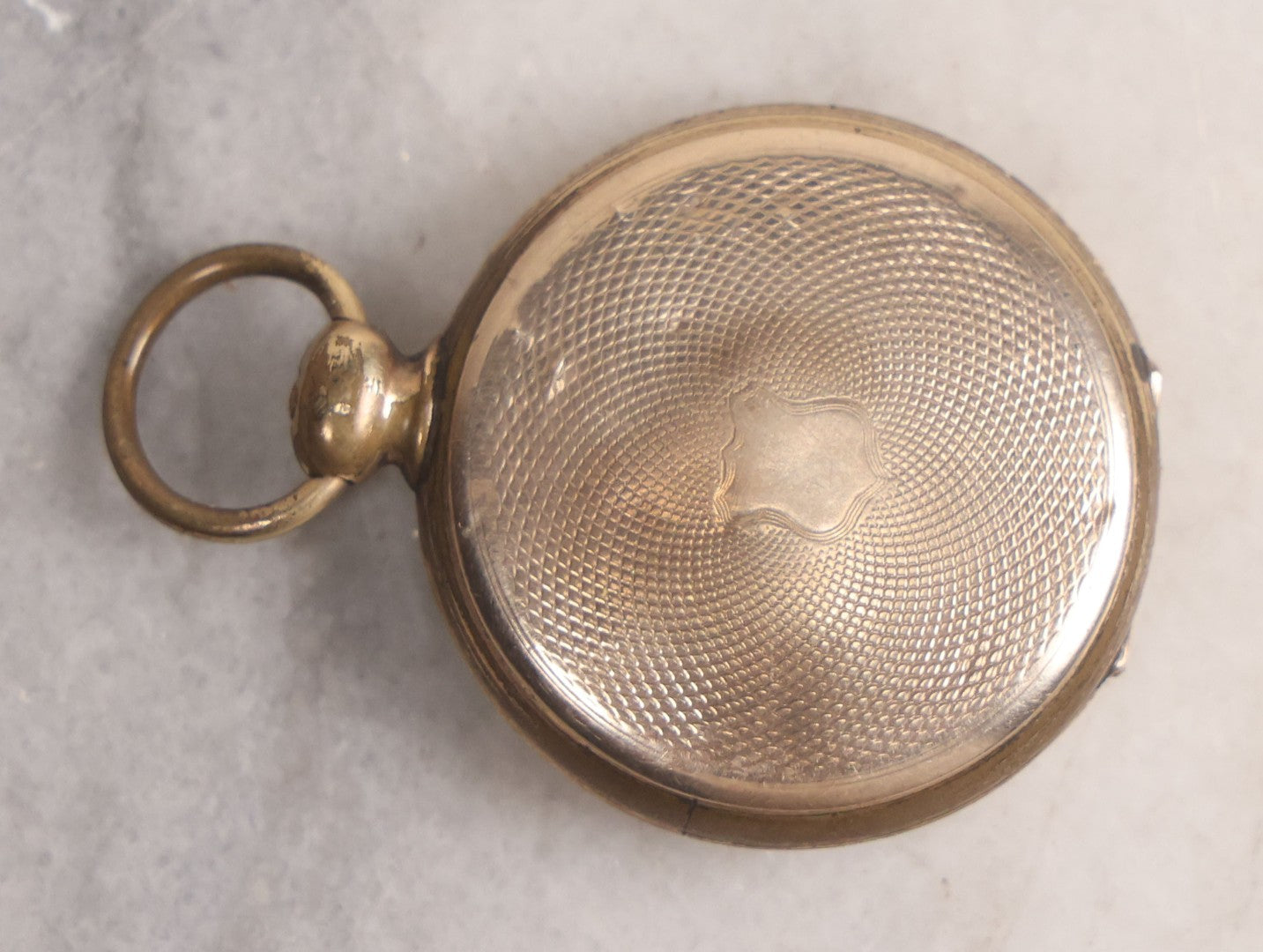 Lot 141 - Antique Gold Toned Locket With Tintype Photographs Of A Young Woman And Man Under Beveled Glass Circles