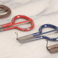 Lot 159 - Grouping Of Four Antique And Vintage Jaw Harps, Mouth Harps, Jew's Harps In Steel With Painted Enamel Finishes