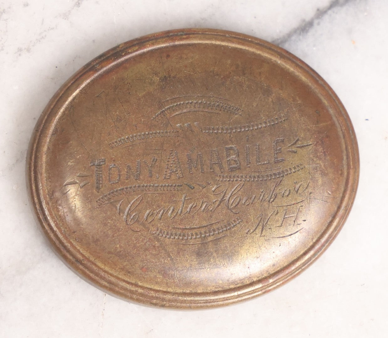 Lot 161 - Trio Of Miscellaneous Vintage Smalls Including Tony Amabile, Center Harbor, New Hampshire Metal Badge, Masonic Printing Block, Vintage Costume Jewelry Cameo Brooch