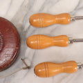 Lot 165 - Grouping Of Four Antique And Vintage Tools Including John Rabone & Sons 50 Ft Tape Measure, 5-1/4" Diameter, And Three Pottery Tools, 7-1/2" L Each