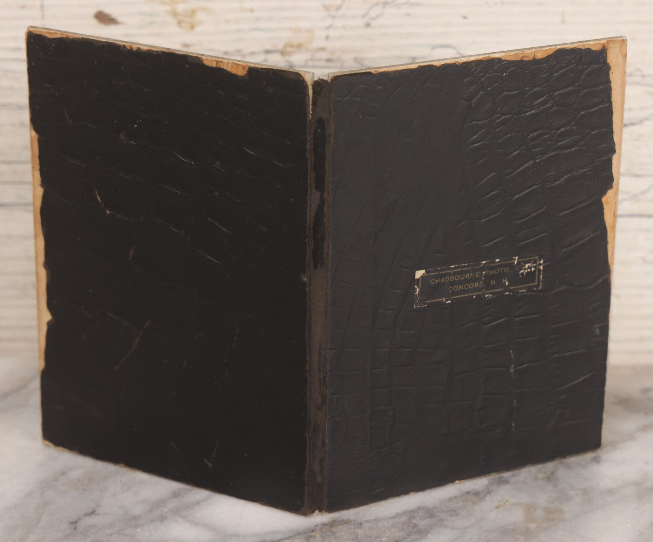 Lot 170 - Grouping Of 10 Antique Photographs In Miscellaneous Frames Including Damaged Thermoplastic Frame, Illustrated Frame With Brownies Characters, Folding Glass Mounted Photo Frame With Pastor And Church, Velvet Frame With C.D.V. Of Child, Tintypes