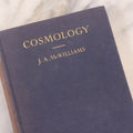 Lot 231 - "Cosmology: A Text For Colleges" Vintage Cosmology Textbook By J. A. McWilliams, Published By The Macmillan Company, New York, 1938