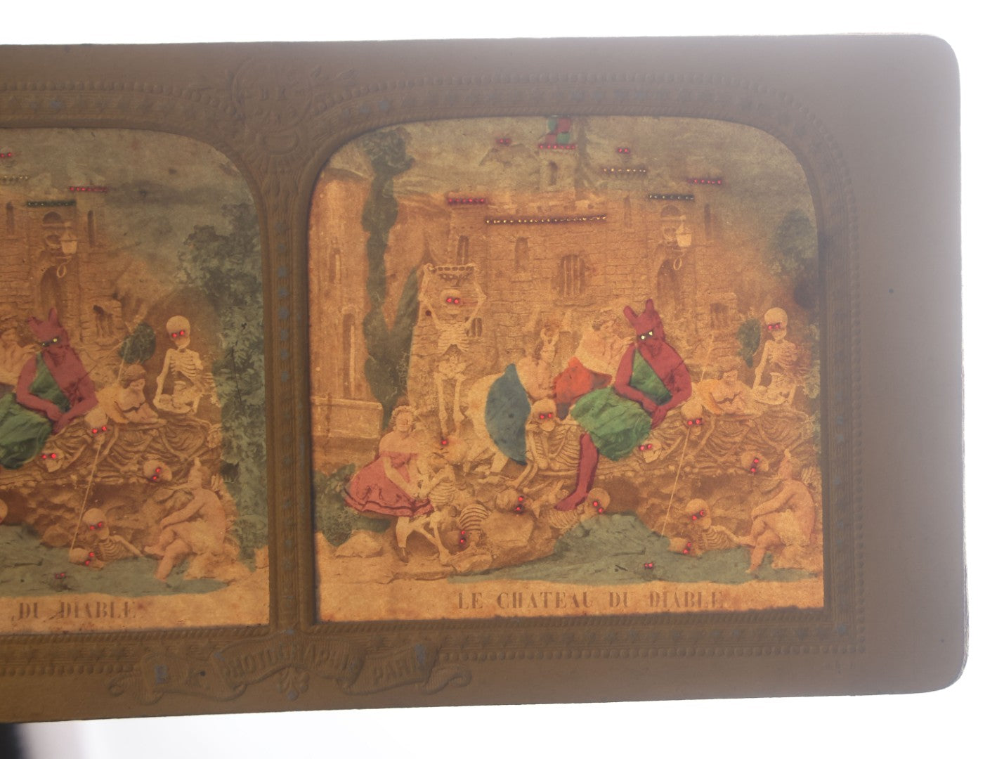 Lot 011 - Antique Hand-Colored French Diablerie Tissue Stereoview Card, "Le Chateau Du Diable" ("The Castle Of The Devil"), Devil With Women And Skeleton Figures, B.K. Photographie, Paris, France