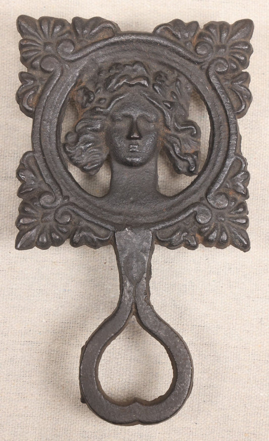 Lot 015 - Antique Cast Iron Figural Trivet With Female Bust And Palmette Corners, Circa Mid-19th Century