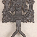 Lot 015 - Antique Cast Iron Figural Trivet With Female Bust And Palmette Corners, Circa Mid-19th Century, 8" Length