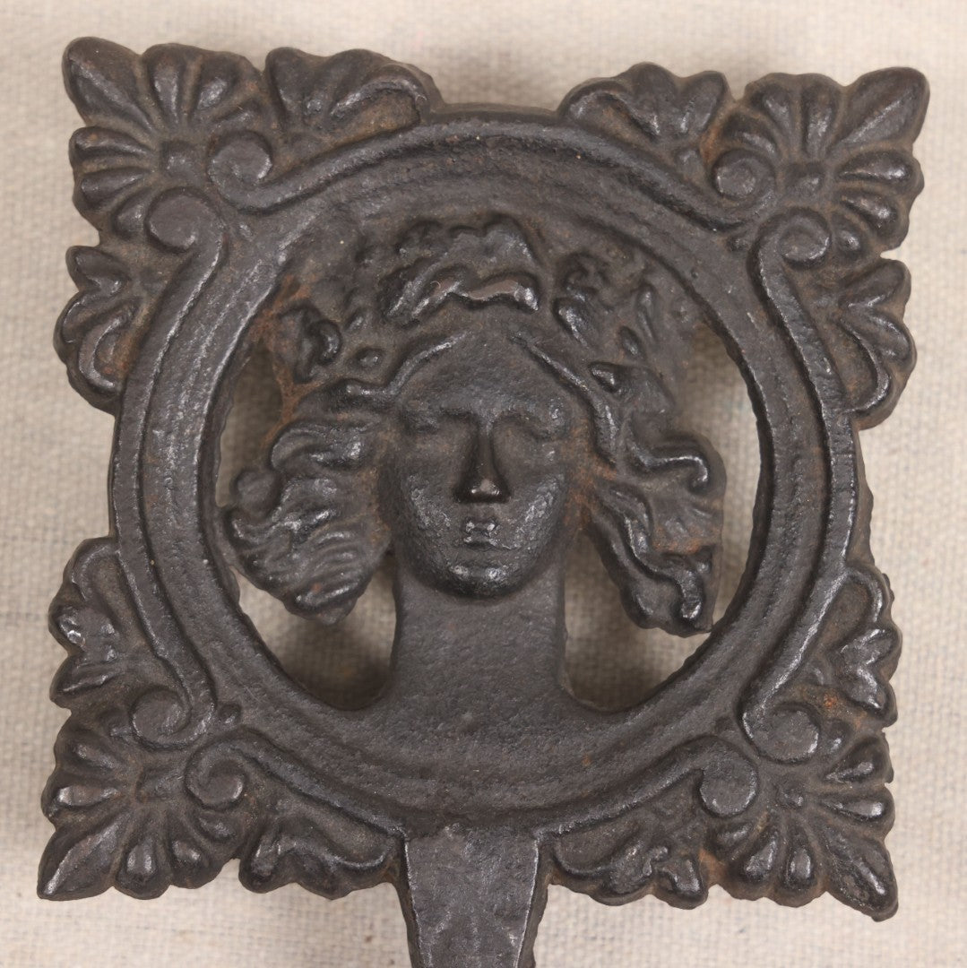 Lot 015 - Antique Cast Iron Figural Trivet With Female Bust And Palmette Corners, Circa Mid-19th Century