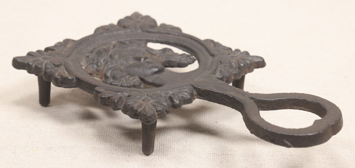 Lot 015 - Antique Cast Iron Figural Trivet With Female Bust And Palmette Corners, Circa Mid-19th Century