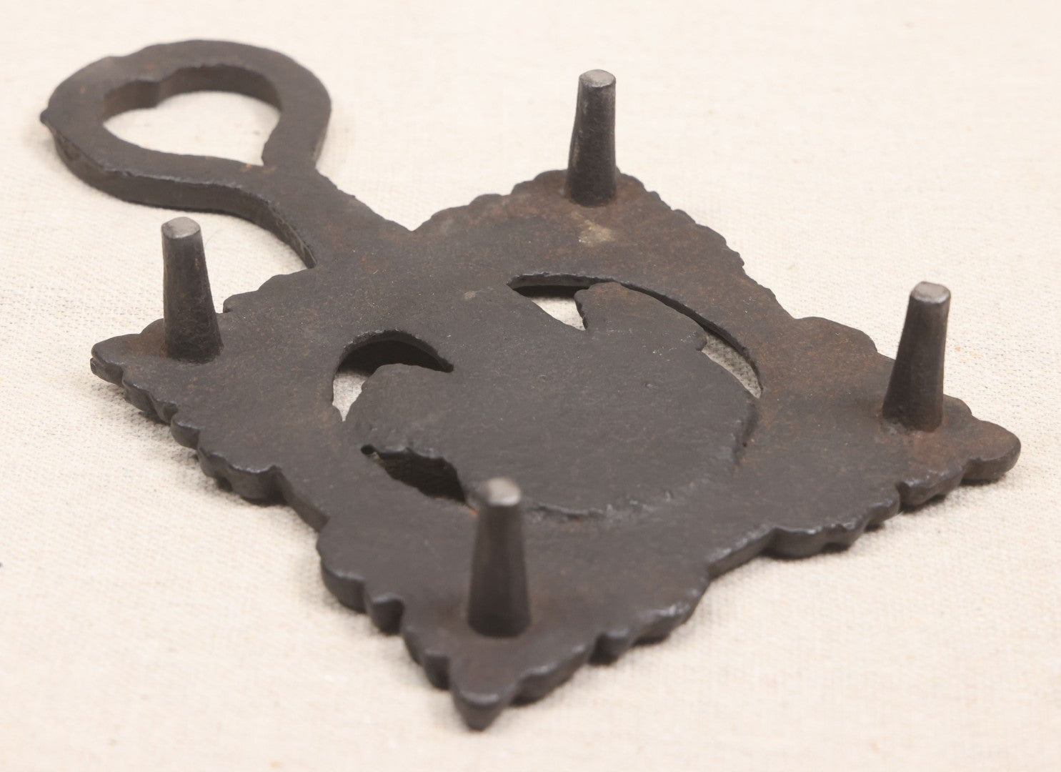 Lot 015 - Antique Cast Iron Figural Trivet With Female Bust And Palmette Corners, Circa Mid-19th Century