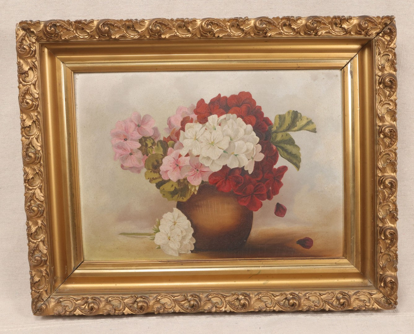 Lot 020 - Antique Oil On Board Floral Still Life Painting Of Geraniums In A Brown Vase, In Gilt Frame
