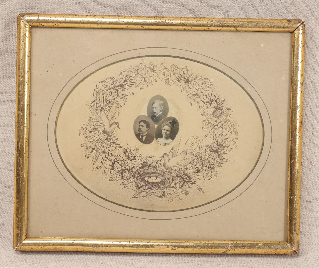 Lot 026 - Antique Victorian Family Portrait Composite With Three Photographs Mounted On Printed Floral Wreath With Birds And Nest, In Gilt Frame