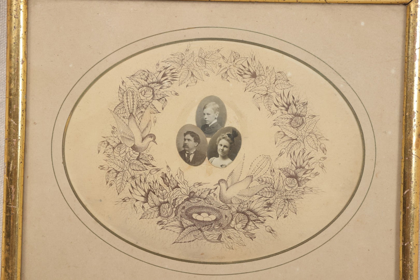 Lot 026 - Antique Victorian Family Portrait Composite With Three Photographs Mounted On Printed Floral Wreath With Birds And Nest, In Gilt Frame