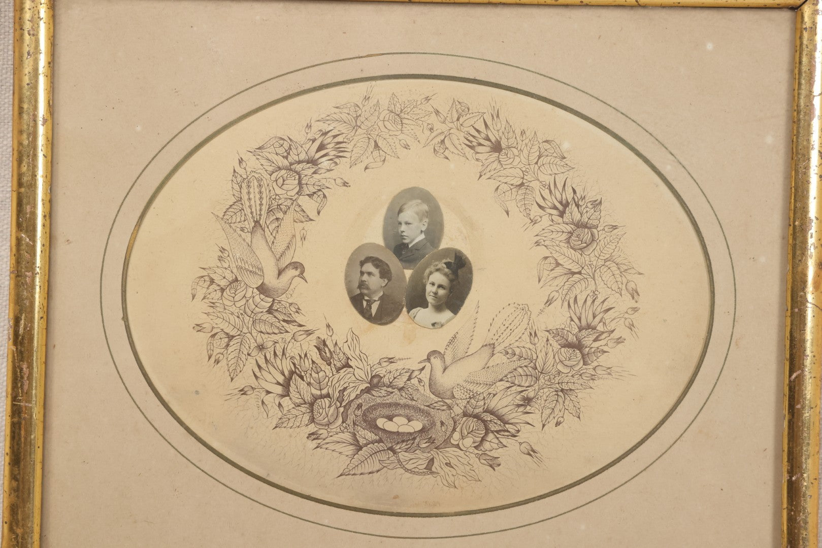 Lot 026 - Antique Victorian Family Portrait Composite With Three Photographs Mounted On Printed Floral Wreath With Birds And Nest, In Gilt Frame