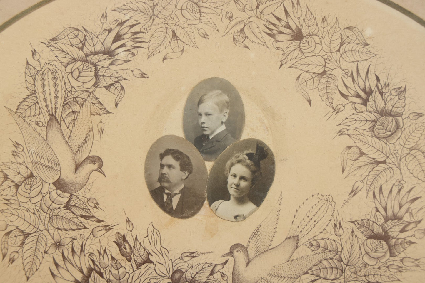 Lot 026 - Antique Victorian Family Portrait Composite With Three Photographs Mounted On Printed Floral Wreath With Birds And Nest, In Gilt Frame