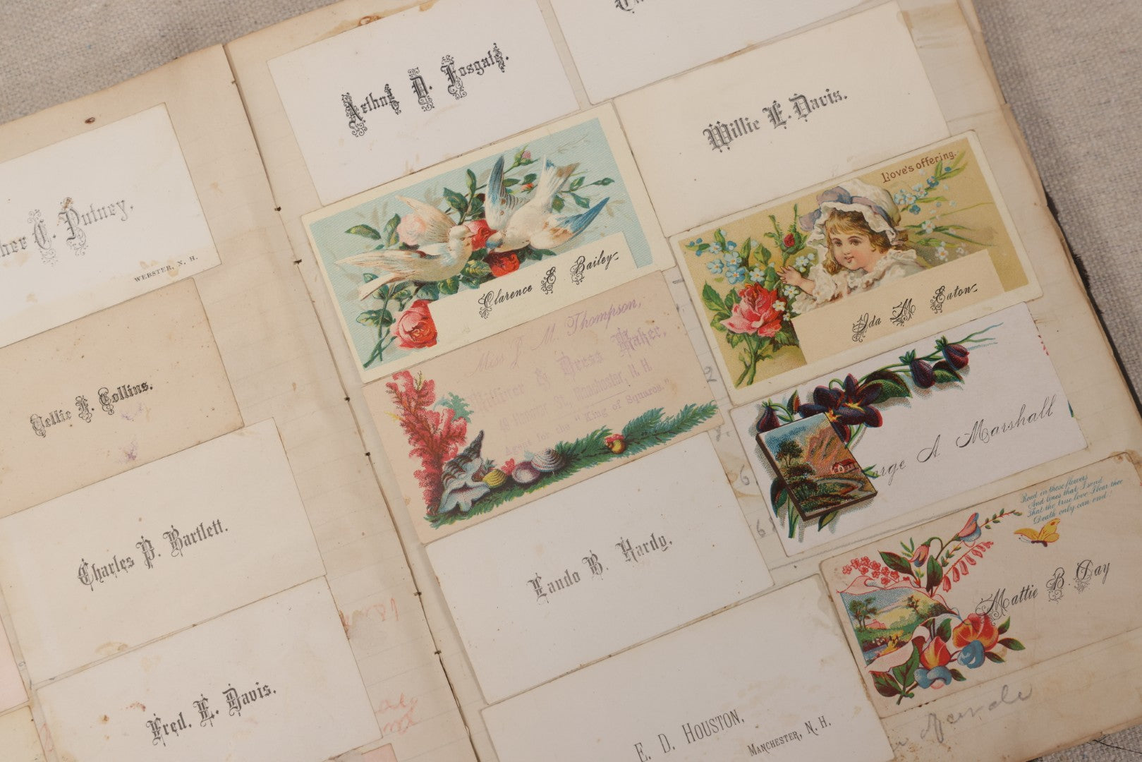 Lot 027 - Antique Victorian Scrapbook Of Approximately 200 Calling Cards And Business Cards Including Hand-Colored And Hand-Signed Examples, Photography, Railroad, And Other Trades