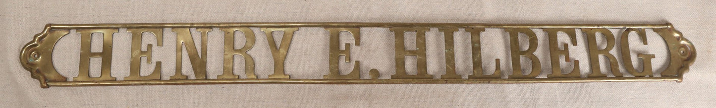 Lot 032 - Antique Brass Name Sign From The E. Hilberg Shaving Parlor, Henry E. Hilberg (1849-1931), Barber, Beaver Falls, Pennsylvania