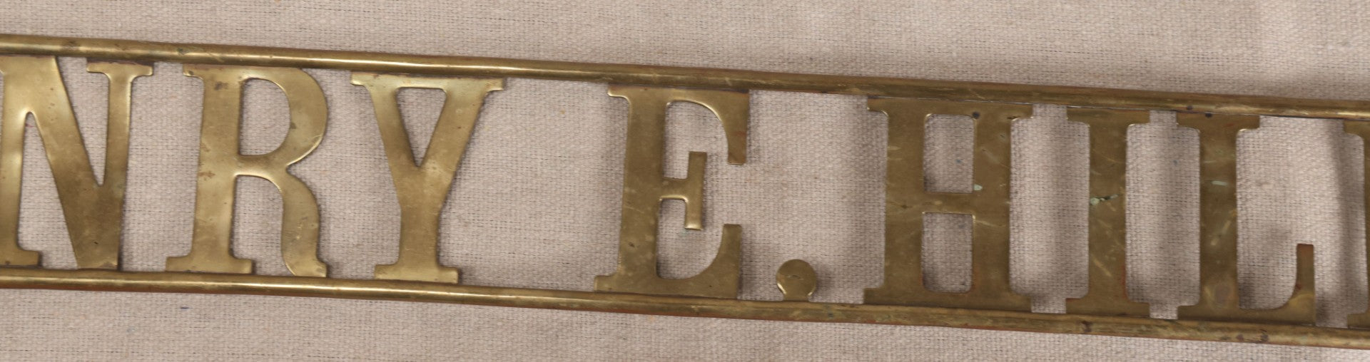 Lot 032 - Antique Brass Name Sign From The E. Hilberg Shaving Parlor, Henry E. Hilberg (1849-1931), Barber, Beaver Falls, Pennsylvania