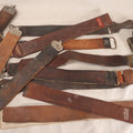 Lot 033 - Grouping Of 13 Antique And Vintage Leather Razor Strops Including Weck Junior, Imperial, Merit By Peter J. Michels, M.L. Brandt Cutlery Co., And Koken's Royal