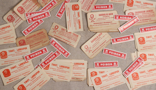 Lot 044 - Grouping Of 100+ Vintage And Antique Apothecary Poison Labels With Skull And Crossbones, Including Chloroform Liniment, Carbolic Acid, And Tincture Of Iodine From Roosevelt & Heintzleman's Pharmacies, Philadelphia, Pennsylvania