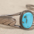 Lot 048 - Vintage Southwestern Sterling Silver And Turquoise Cuff Bracelet With Leaf Appliques And Rope Bezel