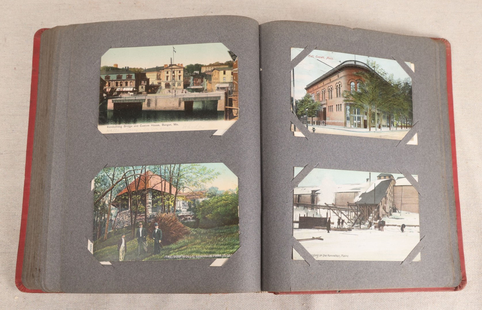 Lot 054 - Antique Postcard Album With Red Cover Containing Approximately 150 Antique And Vintage Postcards, New England, Holidays Including Christmas And Easter, Domestic, And International Subjects