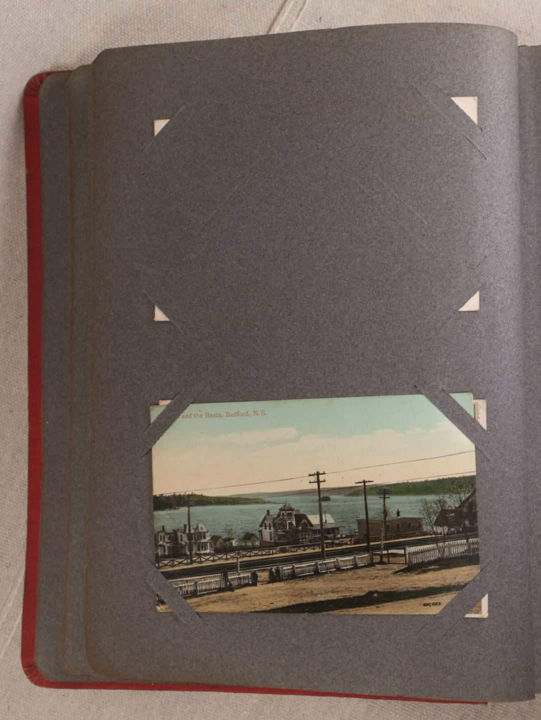 Lot 054 - Antique Postcard Album With Red Cover Containing Approximately 150 Antique And Vintage Postcards, New England, Holidays Including Christmas And Easter, Domestic, And International Subjects