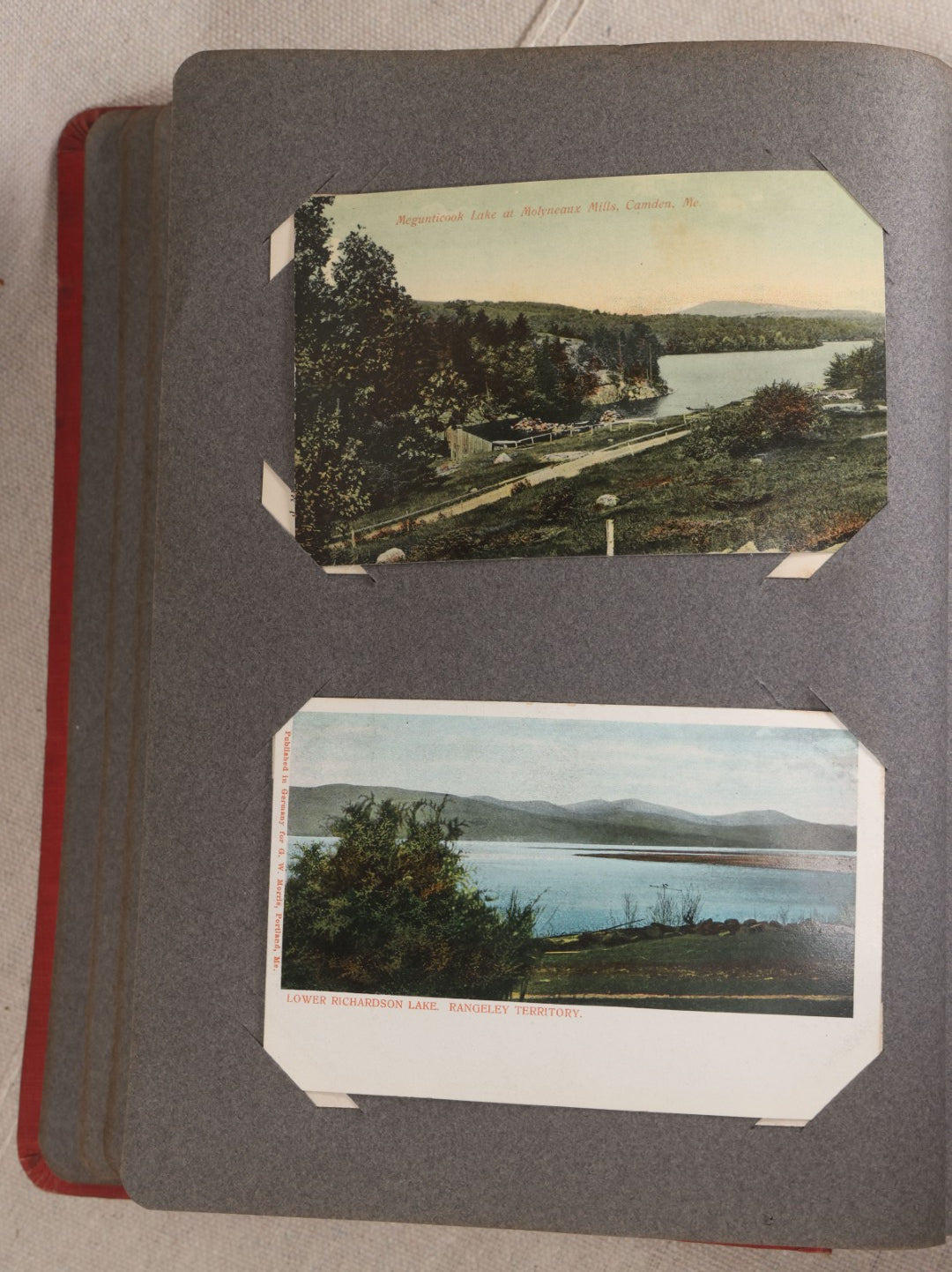 Lot 054 - Antique Postcard Album With Red Cover Containing Approximately 150 Antique And Vintage Postcards, New England, Holidays Including Christmas And Easter, Domestic, And International Subjects