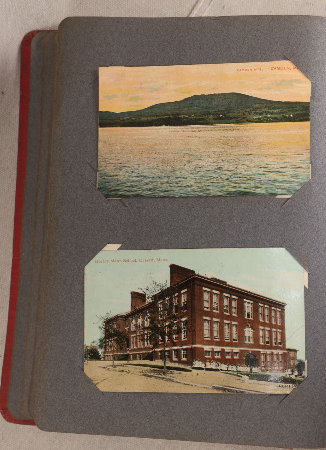 Lot 054 - Antique Postcard Album With Red Cover Containing Approximately 150 Antique And Vintage Postcards, New England, Holidays Including Christmas And Easter, Domestic, And International Subjects