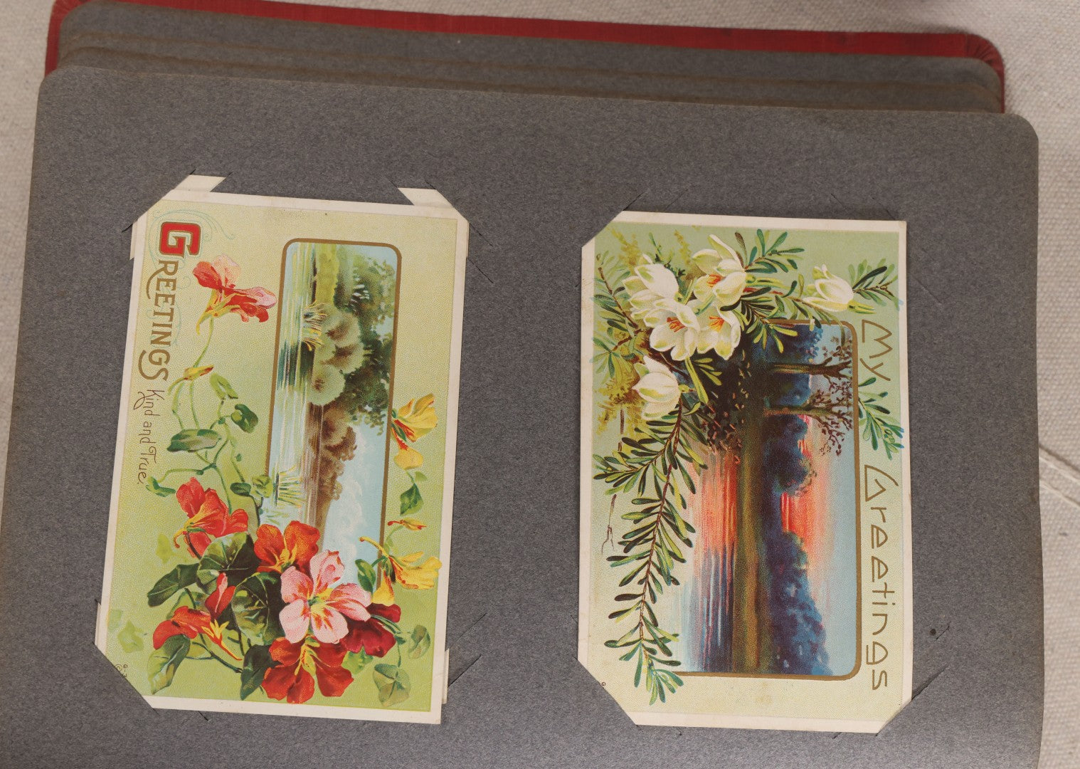 Lot 054 - Antique Postcard Album With Red Cover Containing Approximately 150 Antique And Vintage Postcards, New England, Holidays Including Christmas And Easter, Domestic, And International Subjects