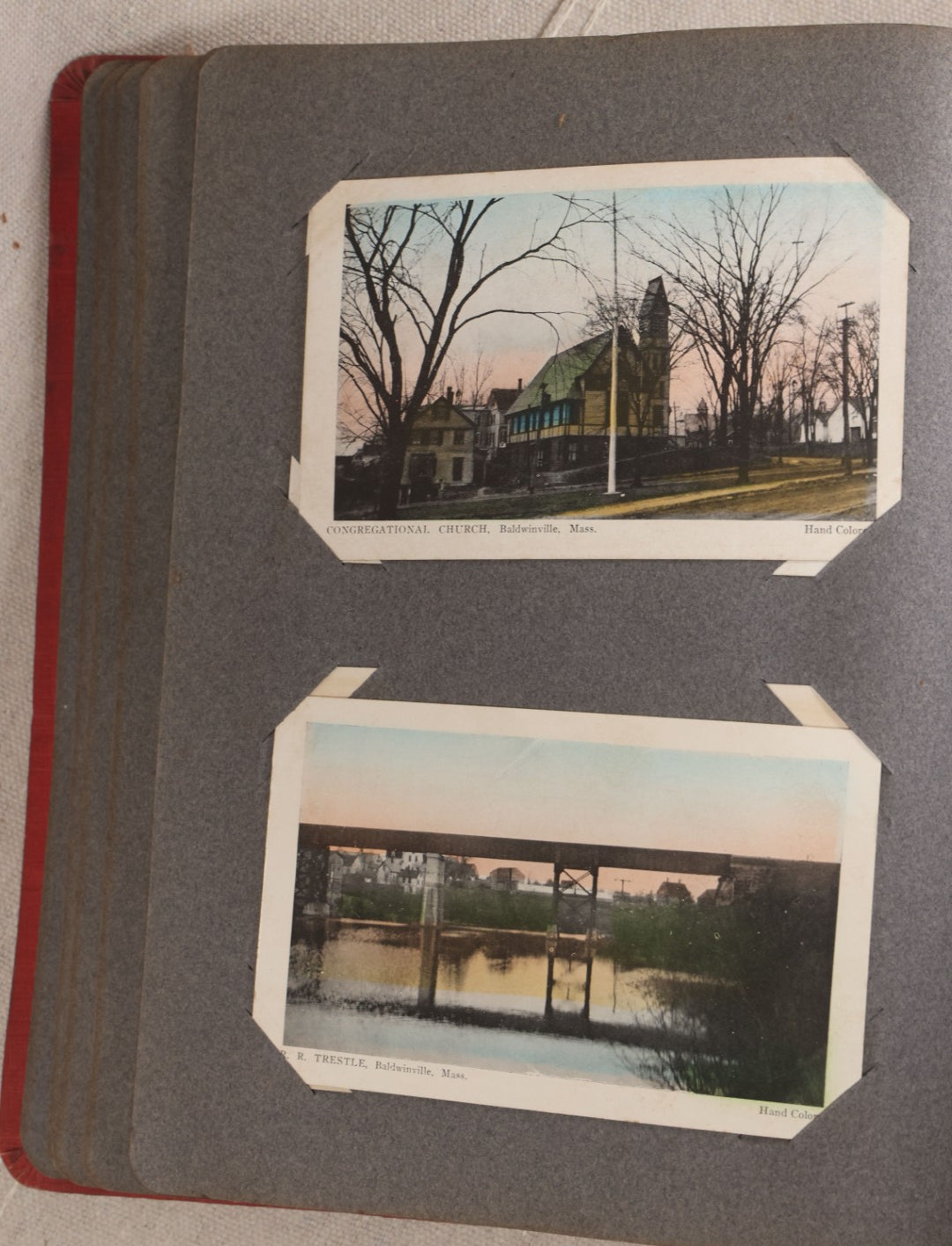 Lot 054 - Antique Postcard Album With Red Cover Containing Approximately 150 Antique And Vintage Postcards, New England, Holidays Including Christmas And Easter, Domestic, And International Subjects