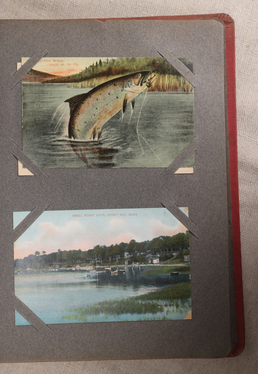 Lot 054 - Antique Postcard Album With Red Cover Containing Approximately 150 Antique And Vintage Postcards, New England, Holidays Including Christmas And Easter, Domestic, And International Subjects