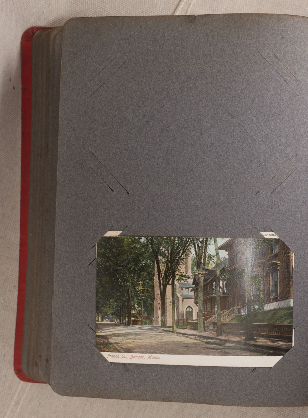 Lot 054 - Antique Postcard Album With Red Cover Containing Approximately 150 Antique And Vintage Postcards, New England, Holidays Including Christmas And Easter, Domestic, And International Subjects
