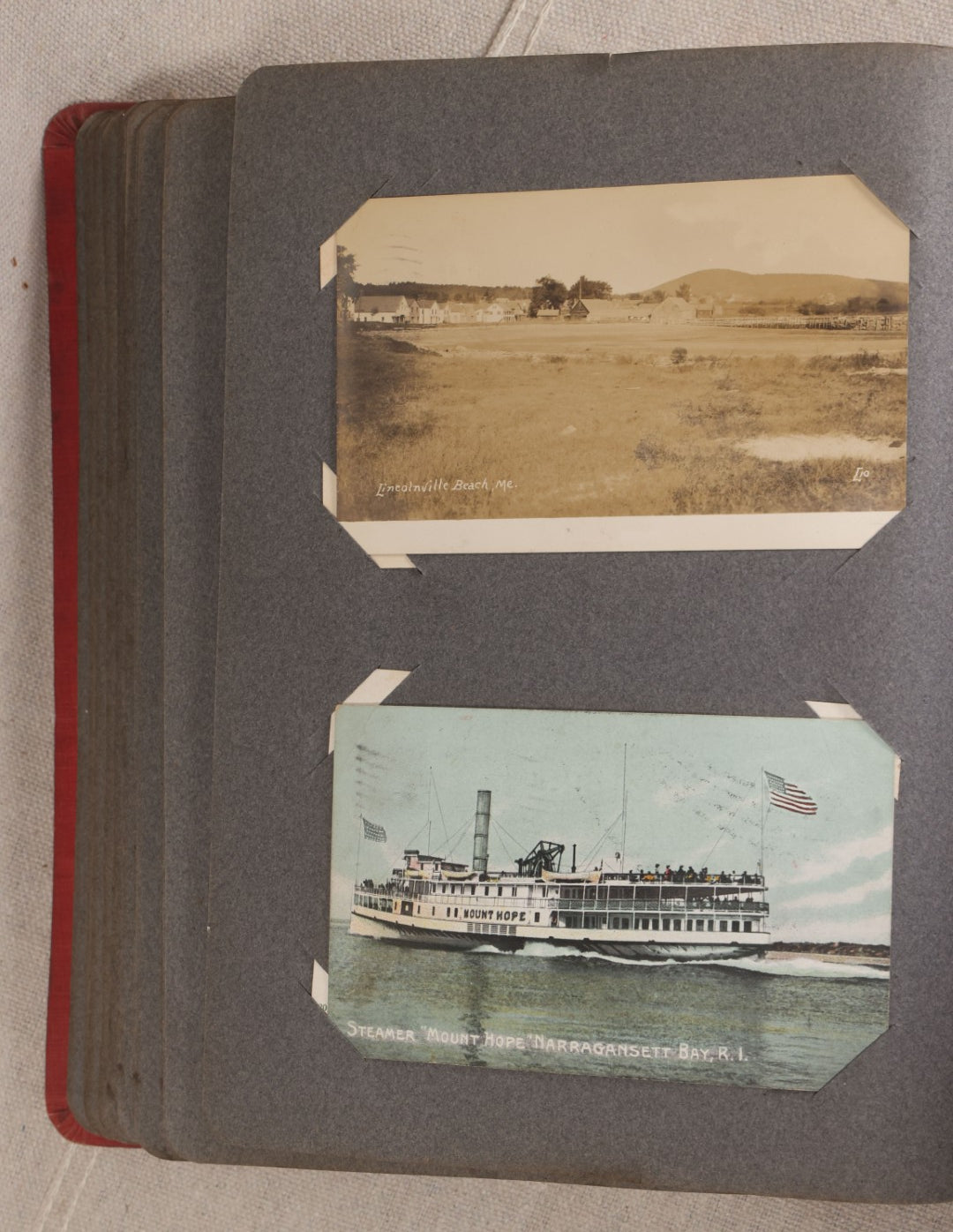 Lot 054 - Antique Postcard Album With Red Cover Containing Approximately 150 Antique And Vintage Postcards, New England, Holidays Including Christmas And Easter, Domestic, And International Subjects