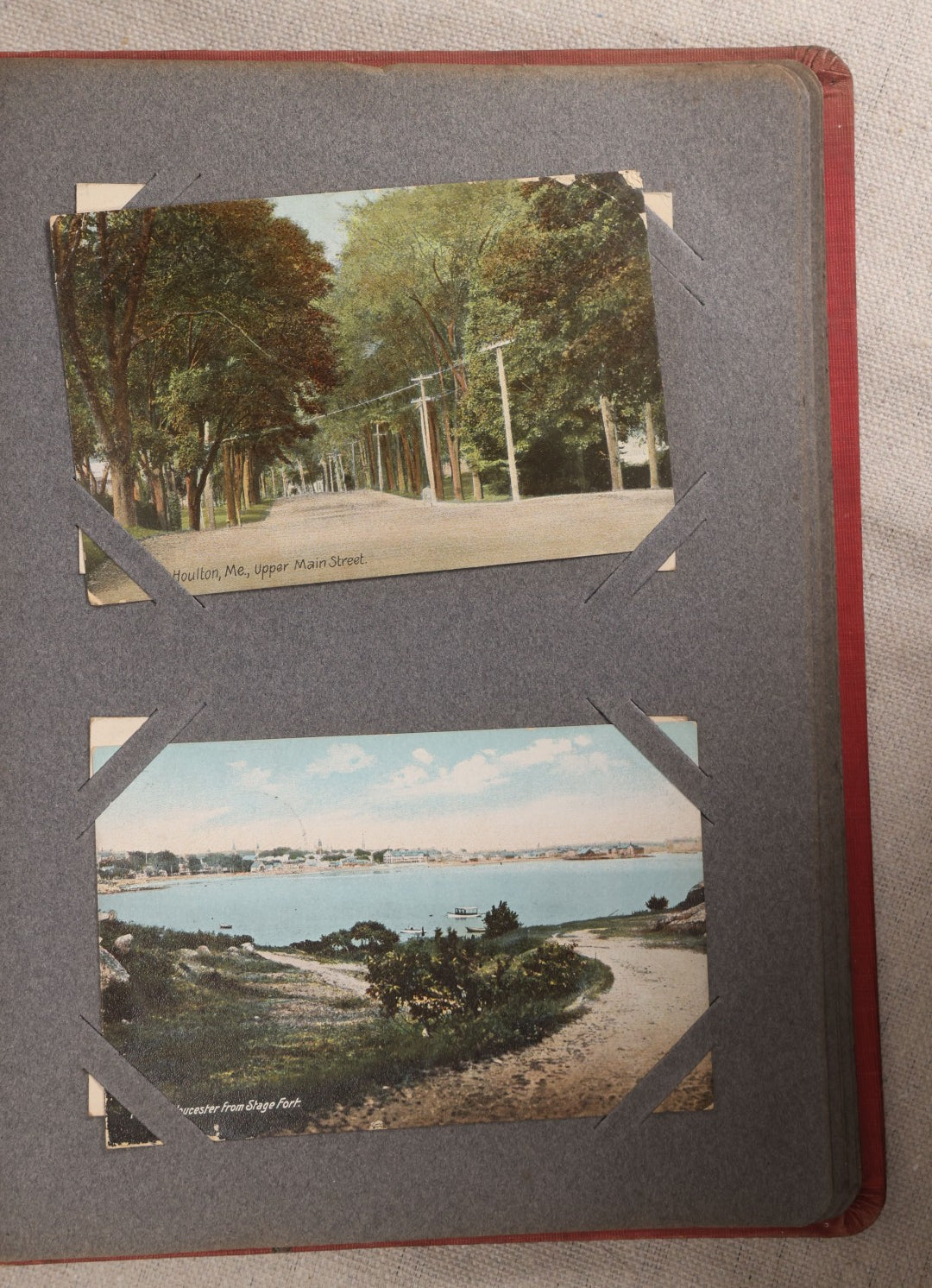 Lot 054 - Antique Postcard Album With Red Cover Containing Approximately 150 Antique And Vintage Postcards, New England, Holidays Including Christmas And Easter, Domestic, And International Subjects
