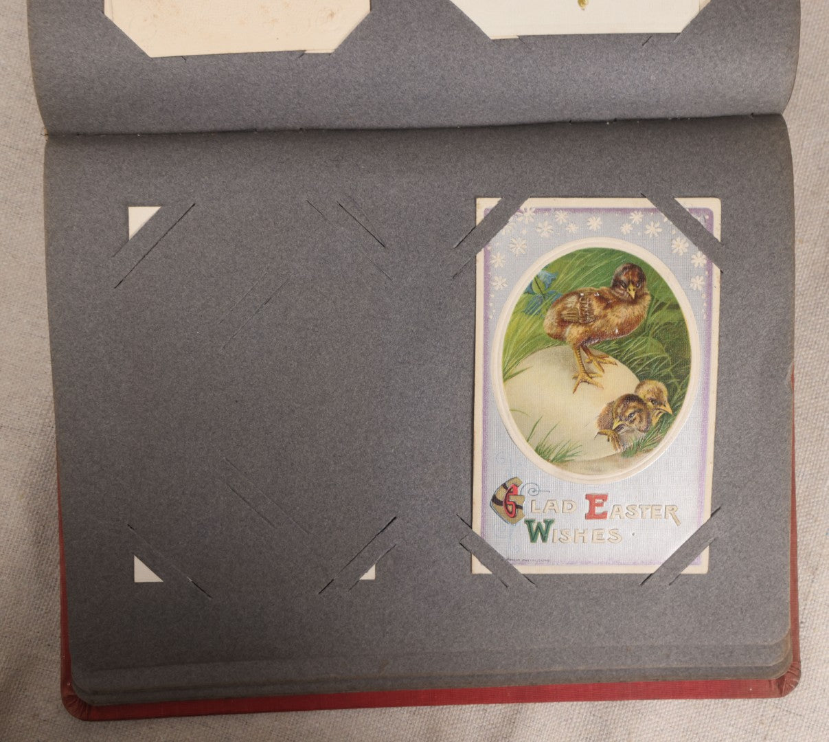 Lot 054 - Antique Postcard Album With Red Cover Containing Approximately 150 Antique And Vintage Postcards, New England, Holidays Including Christmas And Easter, Domestic, And International Subjects