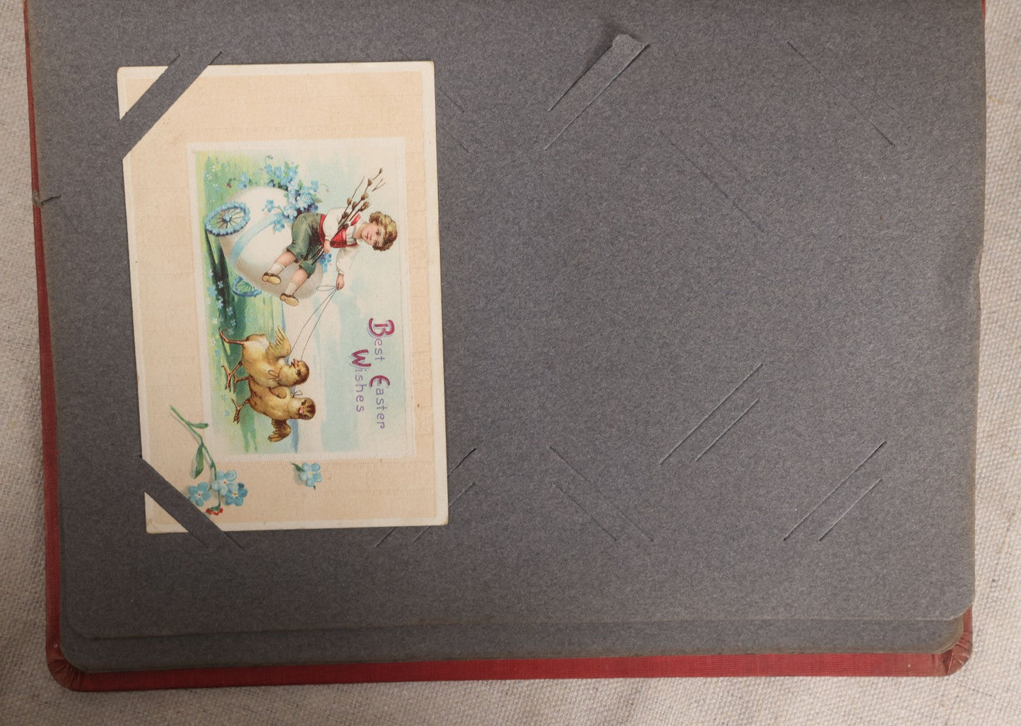 Lot 054 - Antique Postcard Album With Red Cover Containing Approximately 150 Antique And Vintage Postcards, New England, Holidays Including Christmas And Easter, Domestic, And International Subjects