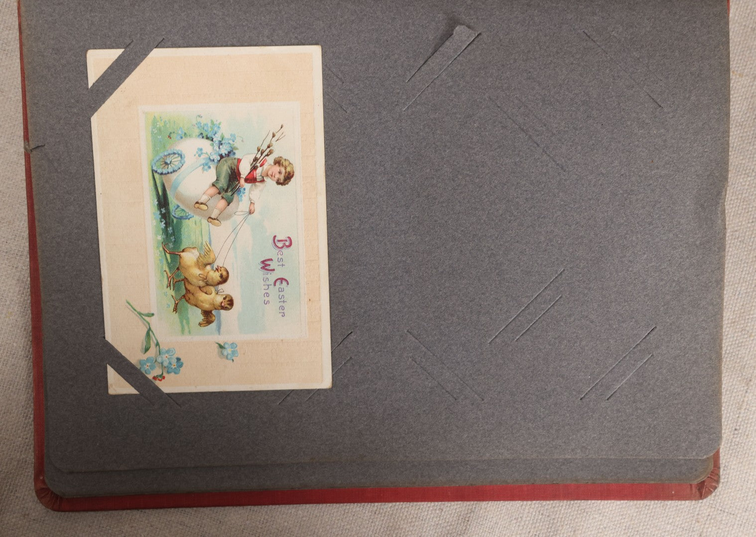 Lot 054 - Antique Postcard Album With Red Cover Containing Approximately 150 Antique And Vintage Postcards, New England, Holidays Including Christmas And Easter, Domestic, And International Subjects