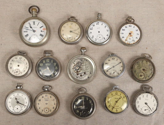 Lot 057 - Grouping Of 14 Antique And Vintage Pocket Watches For Parts Or Repair Including Seth Thomas, Westclox, Elgin, Ingraham, Sentinel, A.N. Anderson, Gotham, And Smiths, Mid-19th To Mid-20th Century