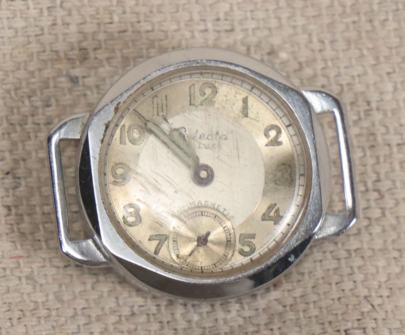 Lot 058 - Grouping Of Nine Vintage Wristwatches For Parts Or Repair Including Besco, Emerson, Rouen, Harmanette, Hanover, Bouquet, And Westclox, Many Swiss Make