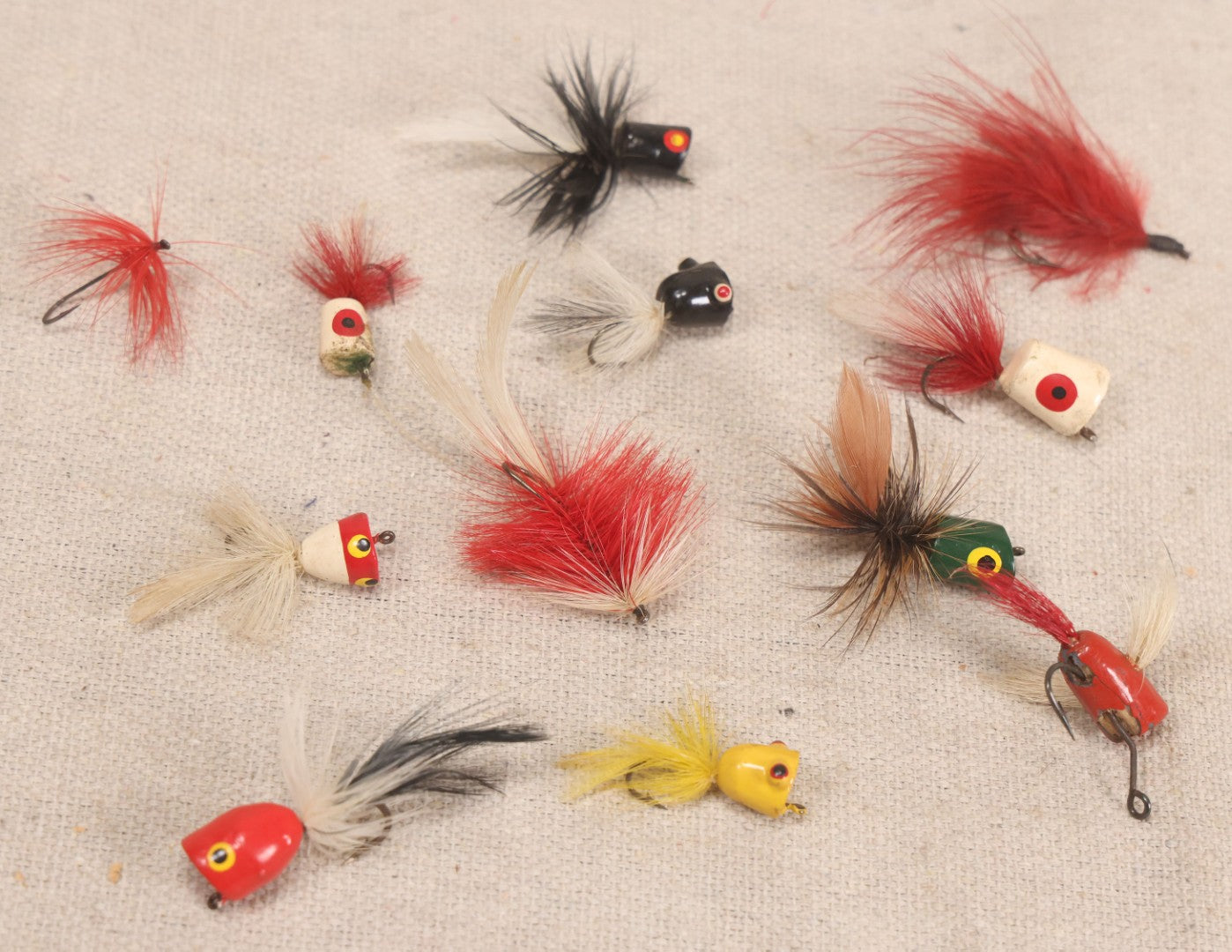 Lot 059 - Grouping Of 12 Vintage Fly Fishing Poppers With Painted Bodies And Feather Tails