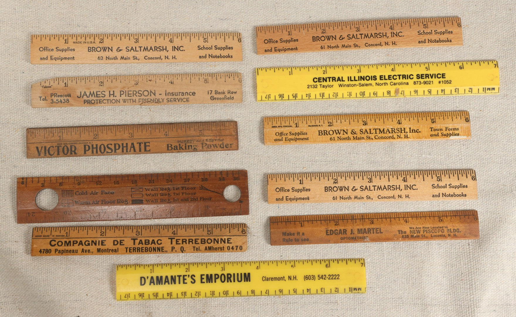 Lot 063 - Grouping Of 11 Vintage Advertising Wood And Plastic Rulers Including Edgar J. Martel Optometrist With Eye Graphics, Brown & Saltmarsh, Victor Phosphate Baking Powder, And More