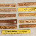Lot 063 - Grouping Of 11 Vintage Advertising Wood And Plastic Rulers Including Edgar J. Martel Optometrist With Eye Graphics, Brown & Saltmarsh, Victor Phosphate Baking Powder, And More