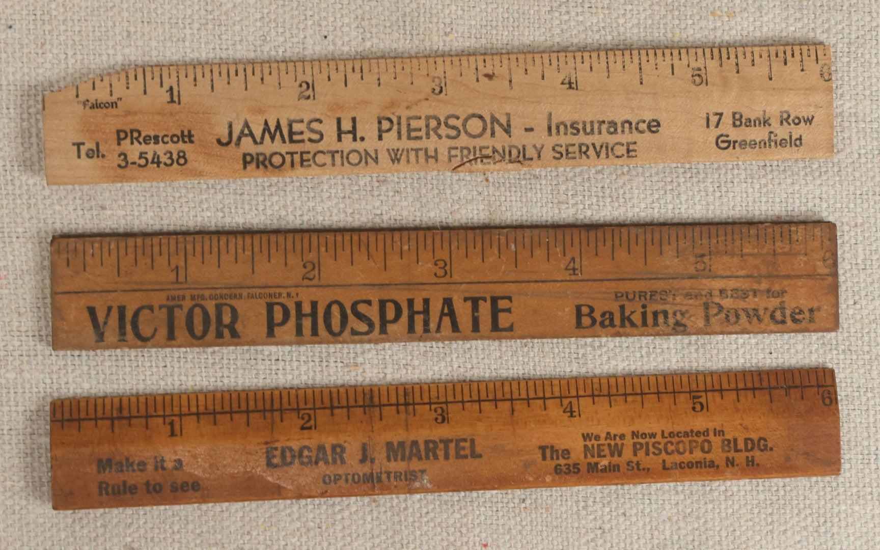 Lot 063 - Grouping Of 11 Vintage Advertising Wood And Plastic Rulers Including Edgar J. Martel Optometrist With Eye Graphics, Brown & Saltmarsh, Victor Phosphate Baking Powder, And More
