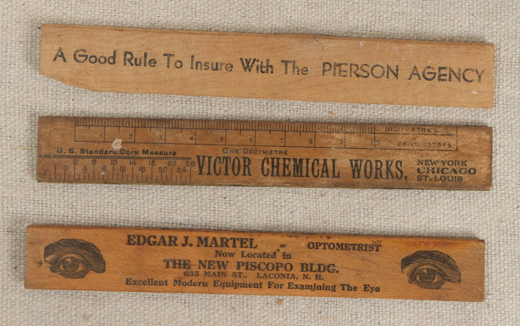 Lot 063 - Grouping Of 11 Vintage Advertising Wood And Plastic Rulers Including Edgar J. Martel Optometrist With Eye Graphics, Brown & Saltmarsh, Victor Phosphate Baking Powder, And More